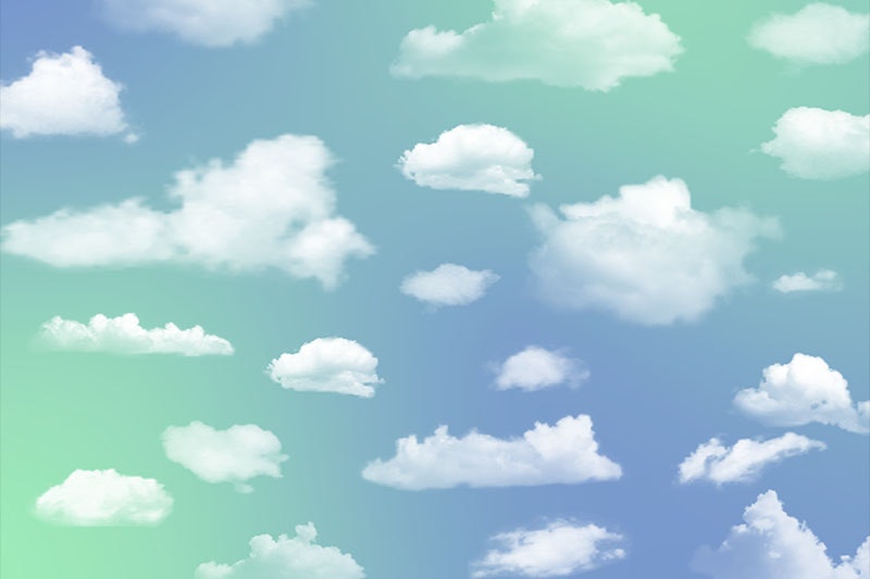 White clouds on a bluey-green sky