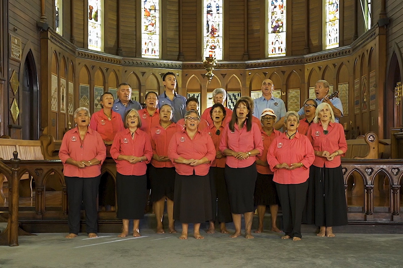 A group of people singing on a church altar