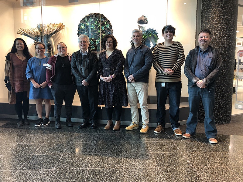 Te Papa staff with Dr Moana Jackson, fourth from left, 2018. Te Papa Eight people pose for a photo