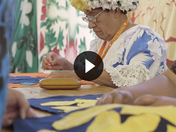 Still from the video 'Tīvaevae: Stitched with love', 2015. Te Papa A lady sews a quilted (a Tīvaevae)