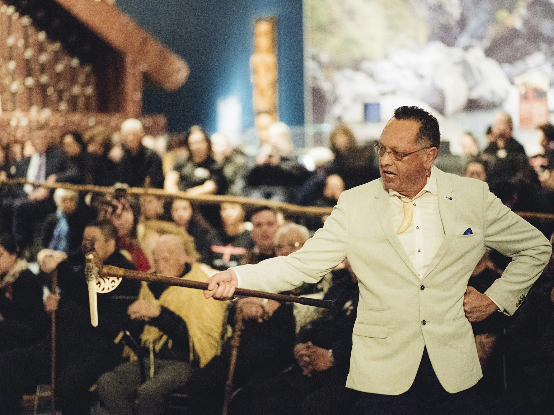 Rongowhakaata kuia holding down the pae of Te Hau ki Tūranga at the opening of the Ko Rongowhakaata: The Story of Light and Shadow exhibition at Te Papa. Photograph by Tim Onnes =""