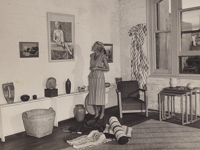 Helen Hitchings inspecting a self-portrait on display in her gallery, Photo News Ltd,  about 1950. Te Papa (CA000124/001/0060) Helen Hitchings inspecting a self-portrait on display in her gallery