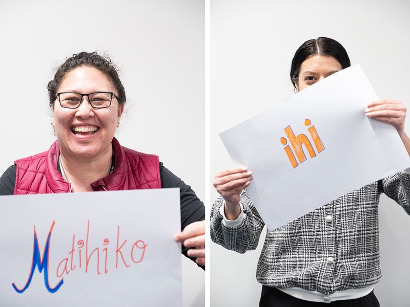 Chloe and Haley with their favourite kupu, 2018. Te Papa Two ladies holding up signs with Māori words 'ihi' and 'Matihiko' on them