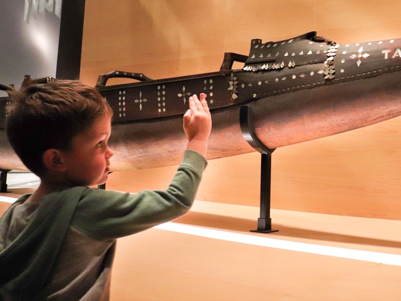 Navigating the Pacific ECE visit, 2017. Te Papa Small child looks at a Pacific vaka
