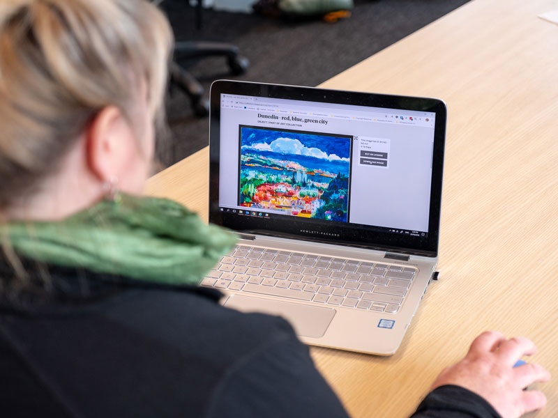 Downloading images from Collections Online, 2018. Photo by Rachael Hockridge. Te Papa (114649) A person on a laptop looking at images on Te Papa's Collections Online website