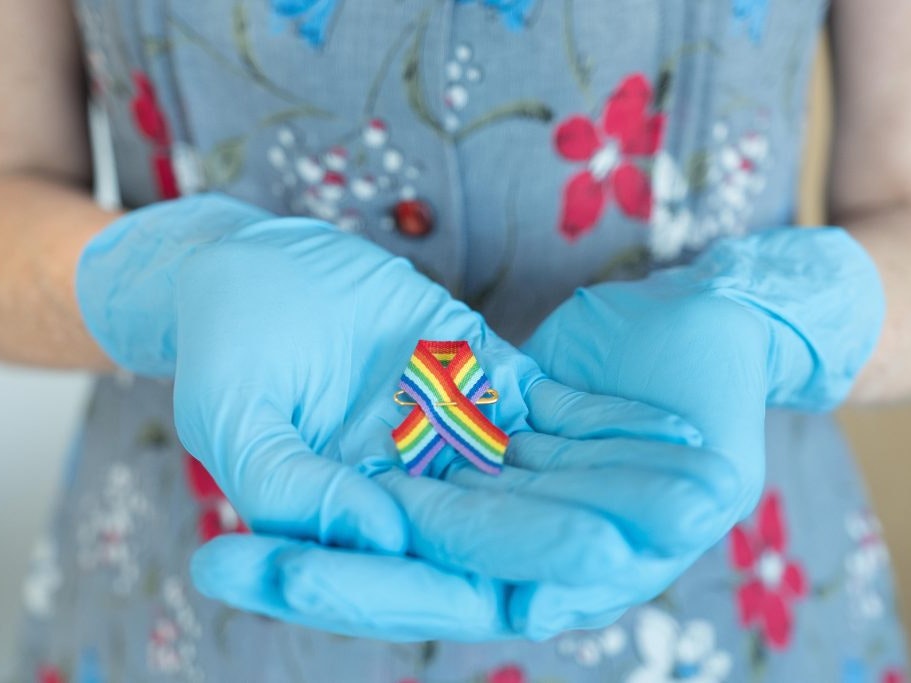 Stephanie Gibson holds a rainbow ribbon from this year’s Pride Festival, 2018. Photograph by Rachael Hockridge. Te Papa Stephanie Gibson holds a rainbow ribbon from this year’s Pride Festival