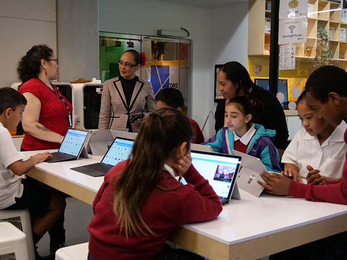 St Anne’s students at Te Papa, 2019. Te Papa Students and teachers work at a desk full of computers