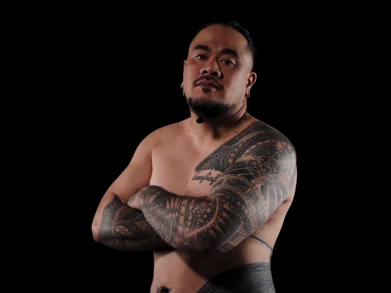Andy Tauafiafi, still from video, 2019. Te Papa A man with Sāmoan tattoos stands with his arms crossed