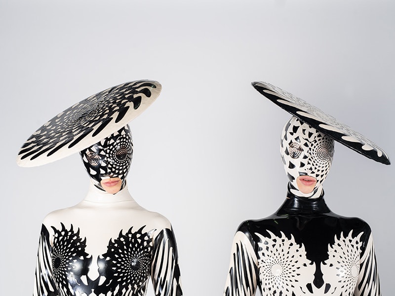 Gemini: The Twins, Dawn Mostow & Ben Gould, United States. Image courtesy of World of WearableArt Ltd Two people wearing black and white costumes