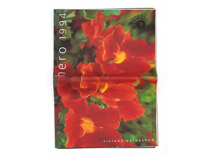 Hero programme, 1994, New Zealand, by The HERO Project Limited, Mr Mark Smith, Deborah Smith, Mr Adam Petry, Mr Mark Summerville, Mr Gerrard Malcolm, Mr Peter Roband, Cox & Dawes Ltd. Gift of Peter Roband, 2020. Te Papa (GH025638) Large-scale printed paper magazine titled Hero 1994 with 'visions unleashed' along the bottom right edge. Featuring colour photograph of orange flowers against green leaves.