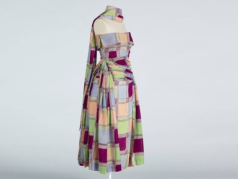 Ensemble, woman's day (dress, stole), 1949, by Elizabeth Henry. Gift of Mary-Annette Hay, 2007. Te Papa (GH015672) a multi-coloured dress on a dummy with a stole around the neck of the same material