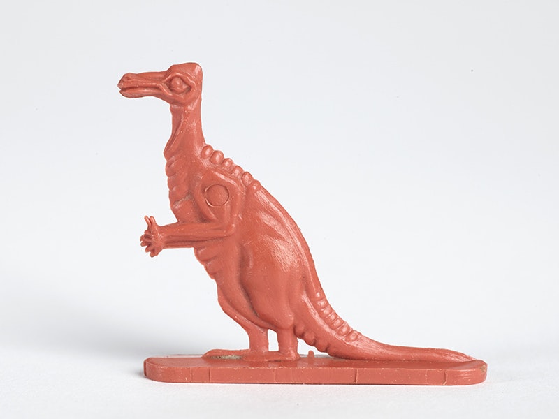 Plastic cereal collectible, Iguanodon, 1962, by Nabisco. Gift of Christine Kiddey, 2011. CC BY-NC-ND 4.0. Te Papa (GH021038/10) An orange plastic dinosaur that came in a cereal box in the 60s