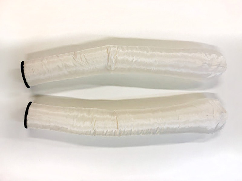 Padded arms. Photo by Sam Gatley. Te Papa two long pieces of padding made to be the shape of arms