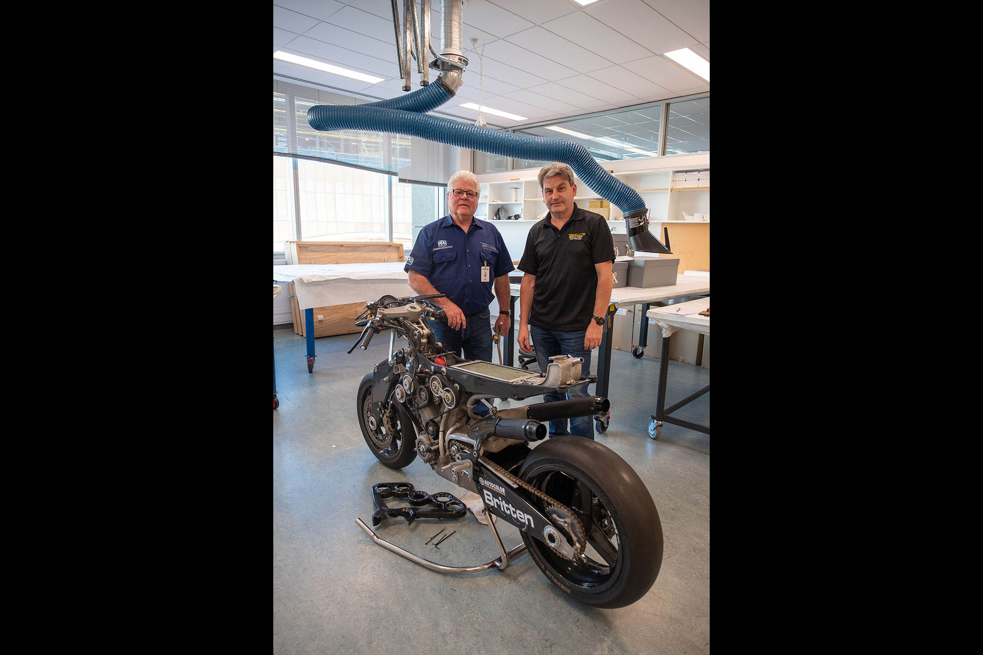 Craig and Bob stand with the Britten Bike in Te Papa’s Conservation Lab