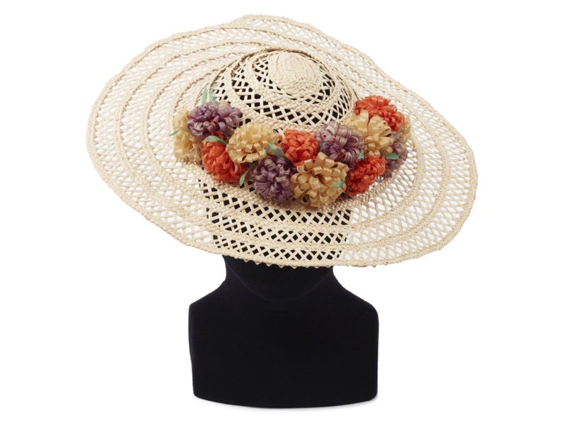 Pulou (Hat), Tokelau, maker unknown. Purchased 1972. Te Papa (FE010325) large brimmed woven sun hat with floral decoration