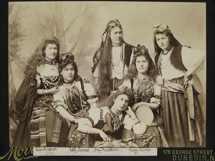 Te Papa (O.020784) Six women posing and facing the camera in a photographic studio