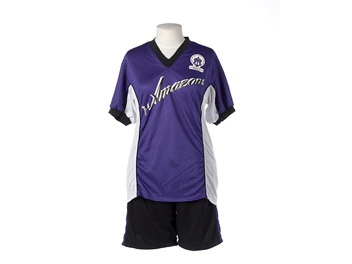 Player's shirt and shorts, Amazon Softball Club uniform, Anna Louise Schoolwear; manufacturer(s); Circa 2000; New Zealand. Gift of the Amazon Softball Club Inc., 2012. Te Papa (GH017600) A purple, black and white sports outfit on a mannequin
