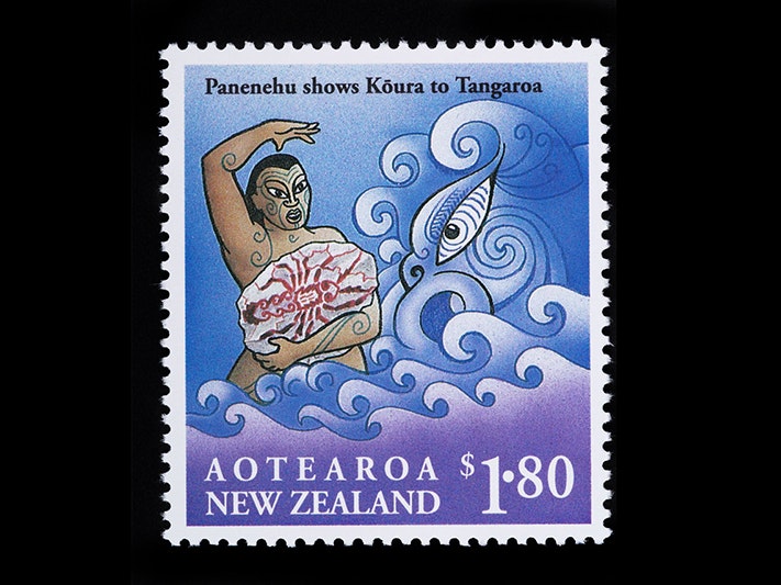 A stamp with a man on it holding a stone with the image of a crayfish on it. There's a taniwha or stylised dragon in the background. A stamp with a man on it holding a stone with the image of a crayfish on it. There's a taniwha or stylised dragon in the background.
