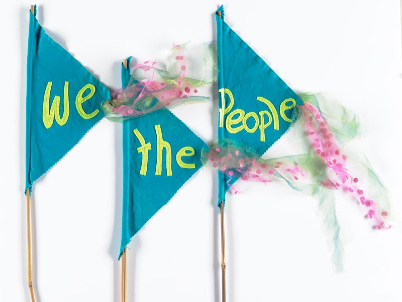 ‘We the People’ flags, January 2017. By Jess Beauchamp, New Zealand. Gift of Jess Beauchamp, 2017. Te Papa (TMP027004) Blue flags which say 'We the People’.