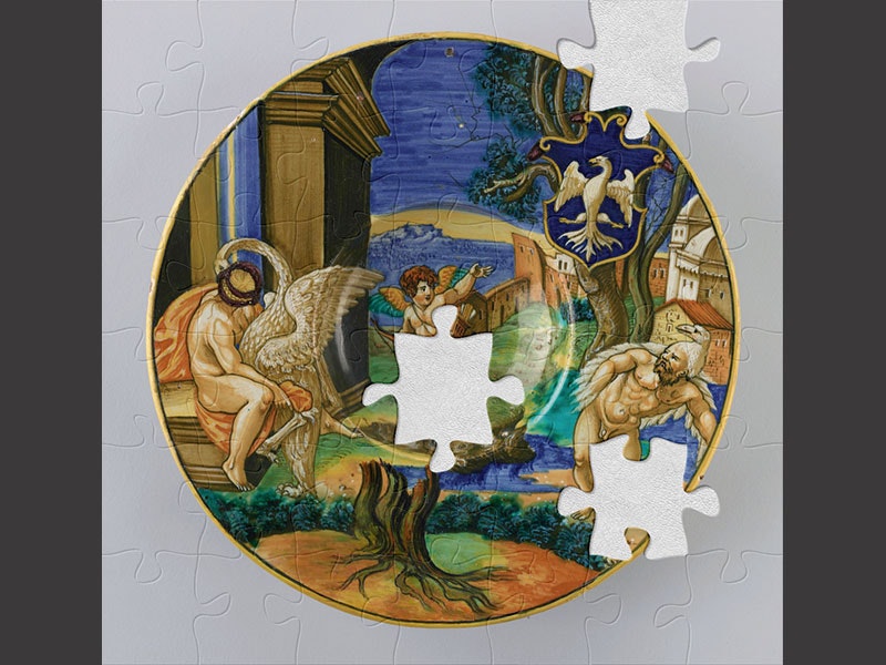 Dish, 1530–1535, Italy, by Francesco Avelli da Rovigo. Purchased 1983 with Charles Disney Art Trust funds. CC BY-NC-ND 4.0. Te Papa (CG001495/a) Ornamental plate with gold rim and a scene painted on it depicting a cherub and two men with swans