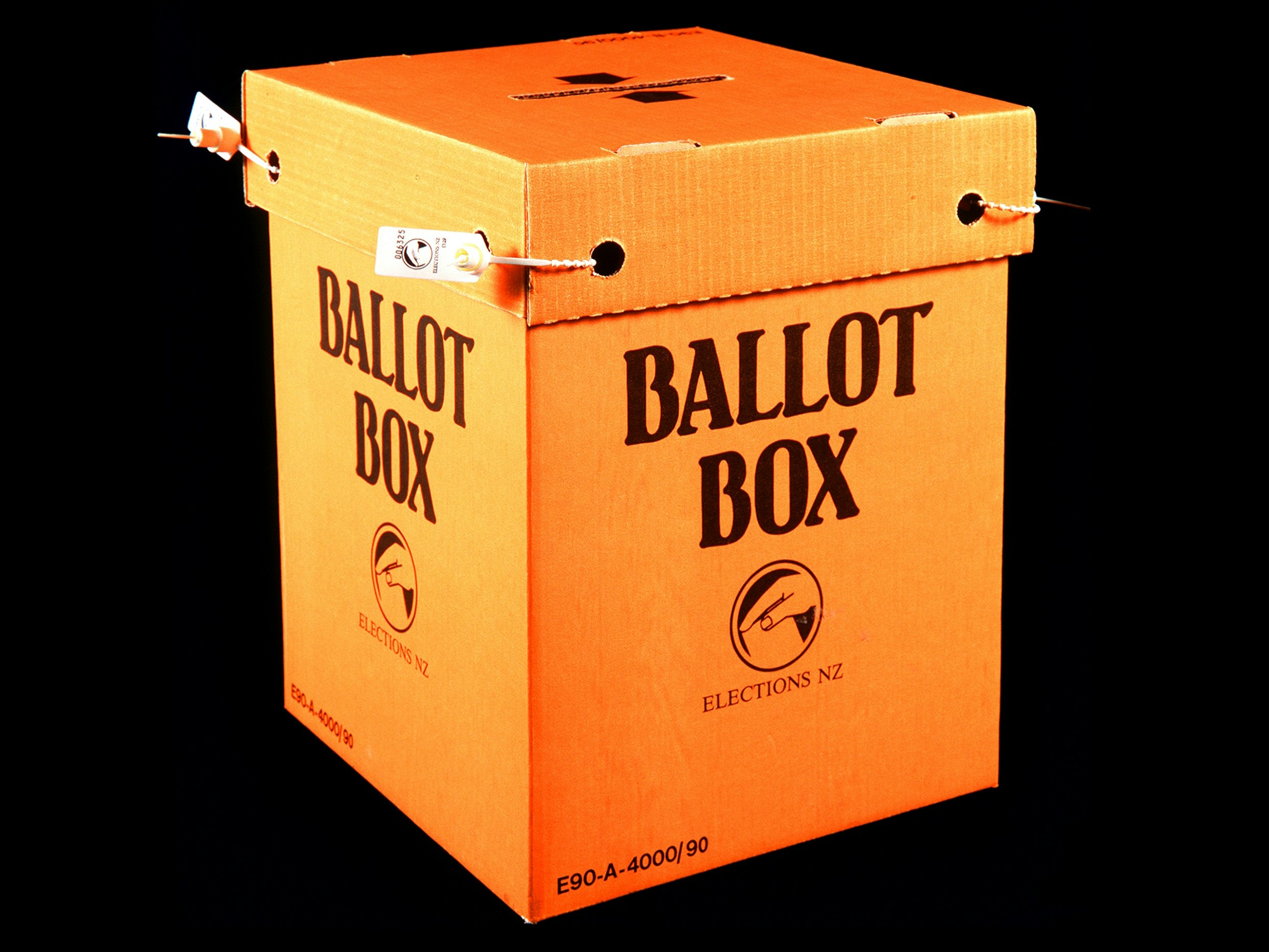Ballot Box, New Zealand Government; 1993, Cardboard and plastic. Gift of the Electoral Commission. Te Papa (GH004193) An orange cardboard box with Ballot Box written on the side