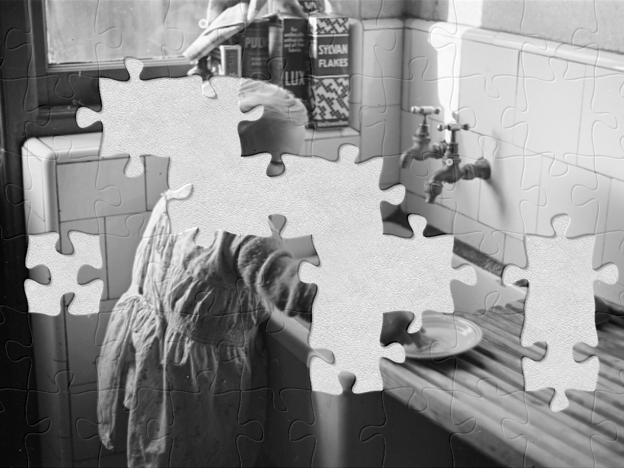 Untitled, December 1937, England, by Eric Lee-Johnson. Purchased 1997 with New Zealand Lottery Grants Board funds. Te Papa (E.001590) A black and white photo with jigsaw pieces missing