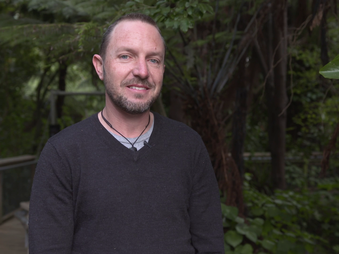 A still from Raranga Matahiko 5a and 5b. Te Papa A man standing in front of trees