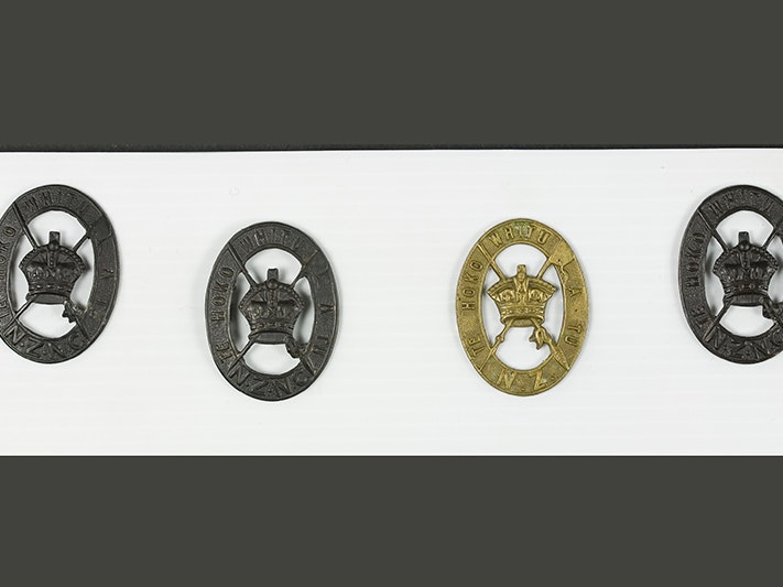 Military Insignia - Maori Battalion, circa. 1916, maker unknown. CC BY-NC-ND 4.0. Te Papa (GH021065) Four medals on a polystyrene background.