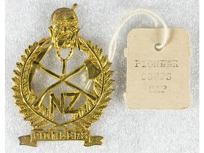 Military Insignia, New Zealand Pioneer Battalion, February 1916-September 1917, maker unknown. Gift of the New Zealand Army Department, 1916. CC BY-NC-ND 4.0. Te Papa (GH017819/16) A gold battalion medal with a tag that says New Zealand Pioneer Battalion.