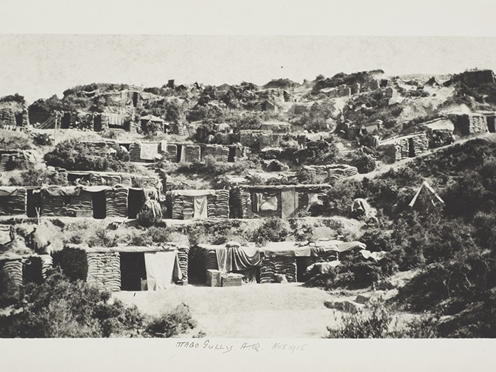 Gallipoli Military Campaign: Otago Gully Headquarters, November 1915, Gallipoli, by Lawrence Doubleday. Te Papa (CA000316/002/0009) A black and white photo of Army huts on the side of a mountain.