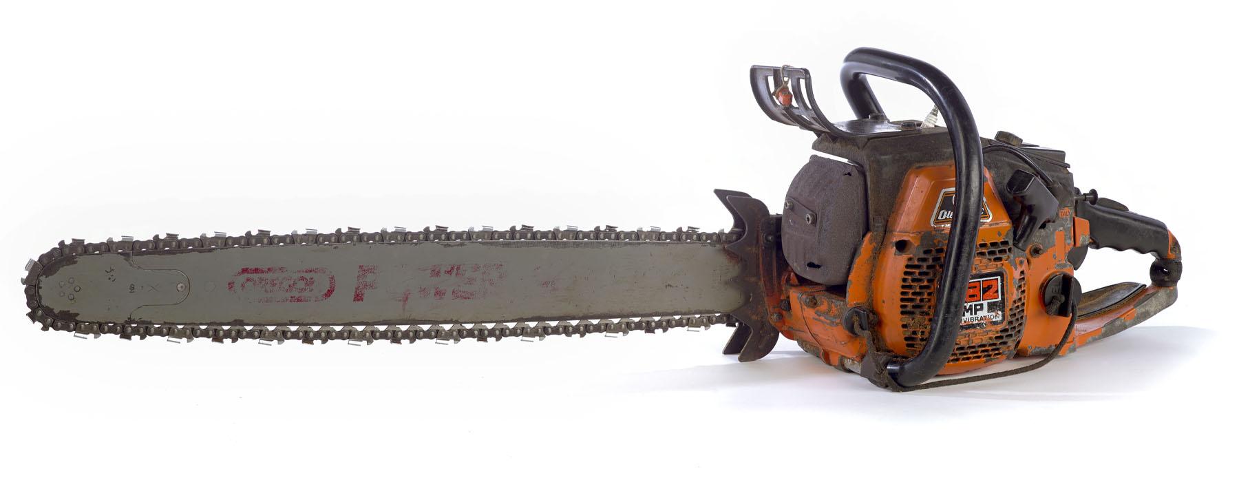 Well-used orange chainsaw