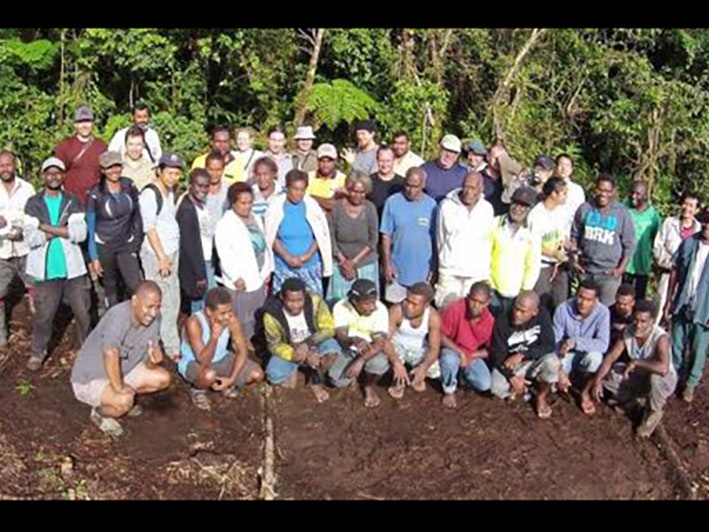 The team at the main field camp at Valevahalo. Photo by Patrick Pikacha, used with permission. A large group of people arranged for a group photo