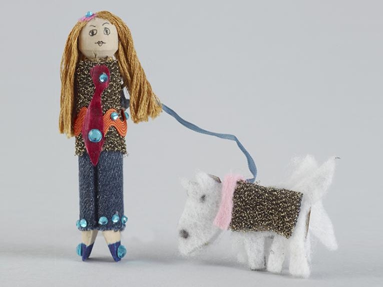 Peg Doll, 'Poppy and Marley', 2011, New Zealand, by Zara Stevenson. Gift of Zara Stevenson, 2011. © Te Papa. CC BY-NC-ND 4.0. Te Papa (GH015367) A doll made from a wooden clothes peg accompanied by a dog on a leash made from material.