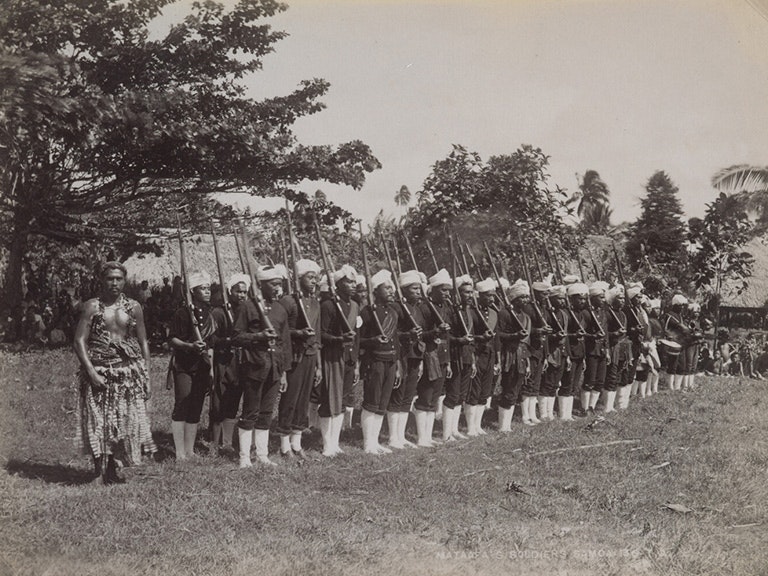 Mata'afa's soldiers, mid to late 1890s, Sāmoa, by Thomas Andrew. Te Papa (O.001099) A black and white photo of a line up of people dressed in uniform