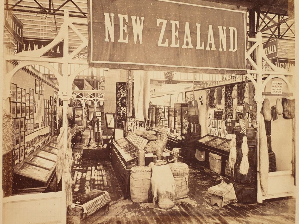 1876 Philadelphia International Exhibition New Zealand exhibition stand displaying specimens, photographs, and ethnographical objects.