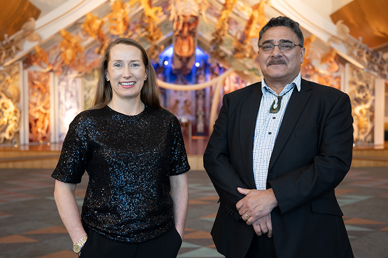 A woman and a man are standing together in the contemporary marae at Te Papa