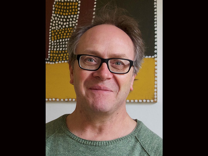 Nicholas Thomas. Photo by Annie Coombes Head and shoulders of a man wearing glasses smiling at the camera