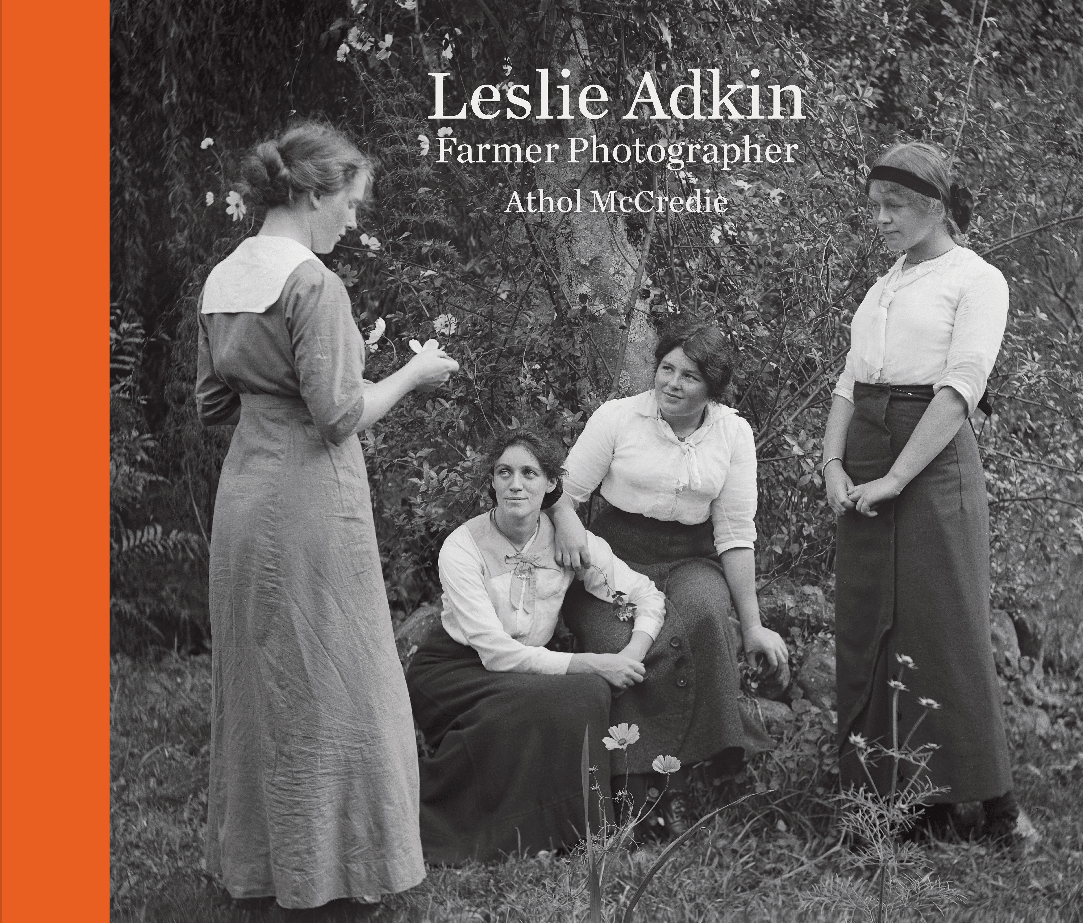 Balck and white photo of four women and the words Leslie Adkin Farmer Photographer Athol McCredie on the top middle