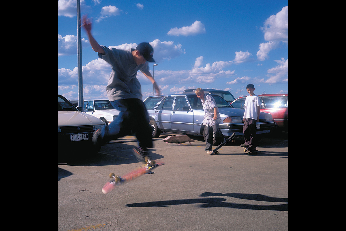 Young people skateboarding in a carpark
