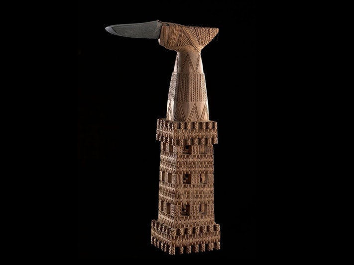 Ruatangaeo (ceremonial adze), circa 1906, Mangaia, maker unknown. Purchased 1907. CC BY-NC-ND 4.0. Te Papa (FE002306) A stone adze with an intricately carved wooden handle bound to it with sennit.