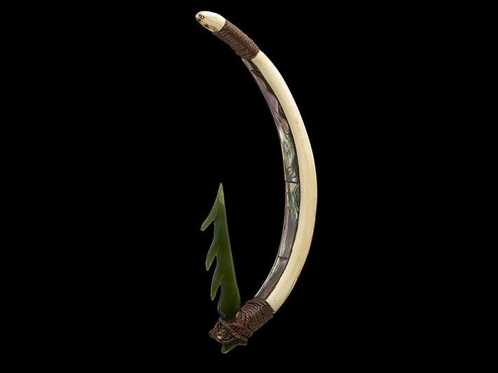 Pā Kahawai (trolling lure), date and maker unknown. Purchased 1968. Te Papa (ME011848) A piece of shell has a sharp piece of greenstone tied onto it with cord making it a fishhook.