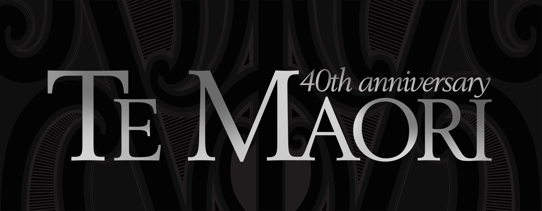 A black rectangle with a faint Māori design in the background with words in silver that say Te Maori 40th Anniversary