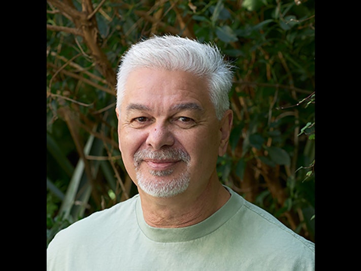 Matiu Baker. Photo by Yoan Jolly. Te Papa Head and shoulders of a man with white hair and a goatee beard