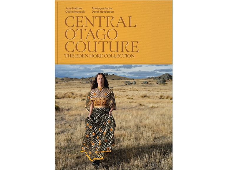 Book cover for Central Otago Couture Book cover for Central Otago Couture with the authors, photographer and title in orange and a photo of a woman in a dress standing in a field.