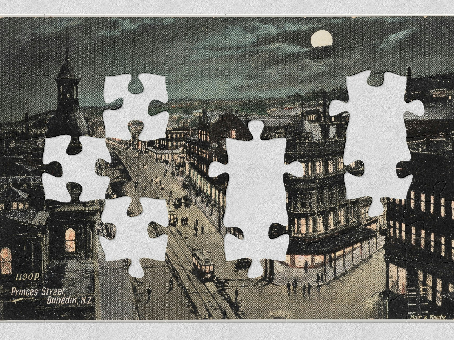 Princes Street, Dunedin, New Zealand, 1905-1907, by Muir & Moodie, Muir & Moodie. Purchased 1998 with New Zealand Lottery Grants Board funds. Te Papa (PS.002507) A hand-tinted postcard of a city street at night with the full moon in the sky. There are jigsaw-shaped pieces missing from picture