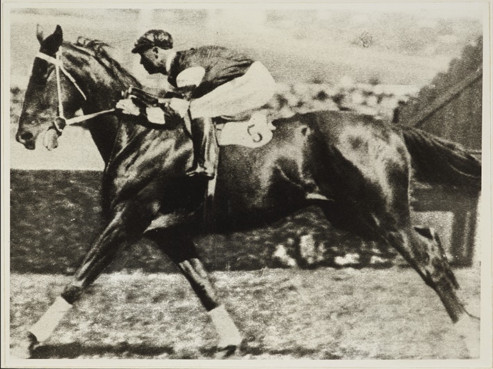 PH003274 A black and white photo of a rider and horse running in a race.