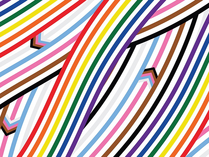 Toka Tamihere, Matariki Pride illustration, 2026. Te Papa. A rainbow of stripes curve and overlap to symbolise te awa (river) current, with arrows swimming like ika (fish) through the colours. Each colour evokes the Progressive Pride flag, with the 6 bold stripes from rainbow pride flag, the white, pink and blue from the transgender flag, yellow and purple from the intersex flag and stripes of brown and black to represent marginalised People of Colour.