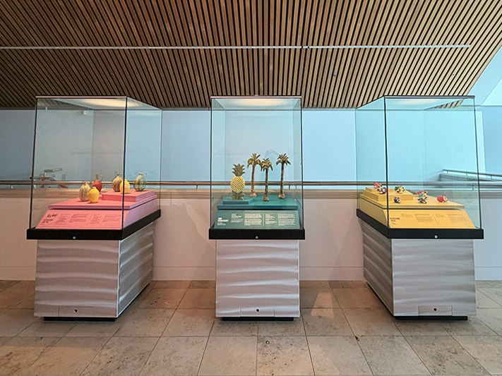 Installation view of Namunamuā | Luscious, Level 6, Te Papa. Photo by Jane Harris. Te Papa Three cases on a stone floor with ceramic artworks in them.